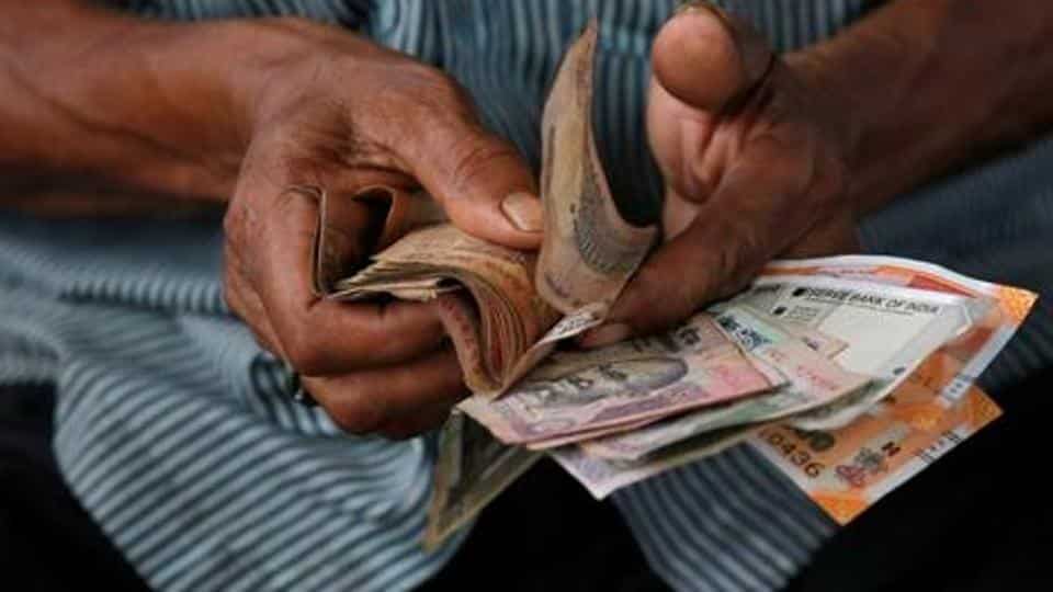 Who Designed the Rupee Symbol? The Story of ₹ and How to Type It Close-up of an Indian banknote showing the rupee symbol