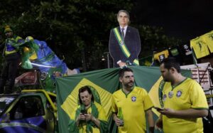 Bolsonaro, Lula headed to runoff after tight Brazil election
