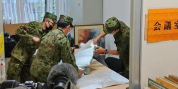 North Korea fires missile over Japan, stopping trains and sparking warning message