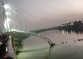 Scores of people fall into river after suspension bridge collapses in Gujarat’s Morbi