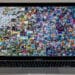 Macbook Air with Beeple pattern " EVERYDAYS: THE FIRST 5000 DAYS". Collage art signed with NFT token. Concept. Stafford, United Kingdom, March 13, 2021.