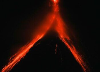 Philippine villagers flee ashfall, sight of red-hot lava from erupting Mayon Volcano