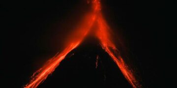 Philippine villagers flee ashfall, sight of red-hot lava from erupting Mayon Volcano