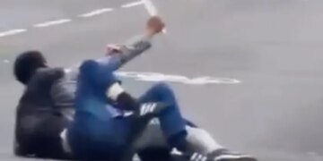 Man fends off attacker who tries to stab him as shocked onlookers shout for help: video