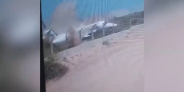 WATCH: Plane skids off runway upon arrival, smashes to pieces on protective barrier