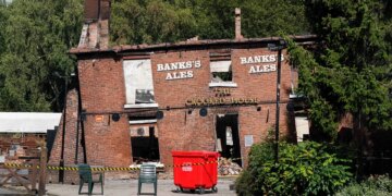 2 men arrested, accused of arson attack on England's 'Crooked House pub'