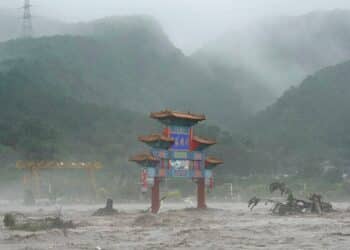 Thousands evacuated as Beijing flooding kills at least 20, leaves 27 others missing