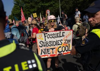 Climate protesters break through police barrier, block Dutch highway