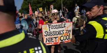 Climate protesters break through police barrier, block Dutch highway