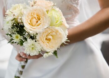 Fashion Influencer Slammed For Hiding ‘Ugly’ Red Exit Signs At Viral Wedding Ceremony