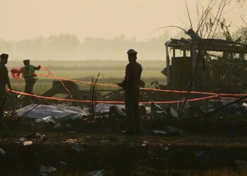 Remains of Thai factory explosion victims taken to temple for identification