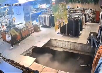 WATCH: Woman falls through floor as possible sinkhole opens up under shopping mall