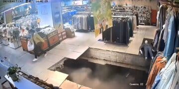 WATCH: Woman falls through floor as possible sinkhole opens up under shopping mall