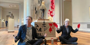 Climate activist charged after smearing paint on sculpture