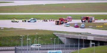 Climate activists glue themselves to runway at Munich airport in Germany