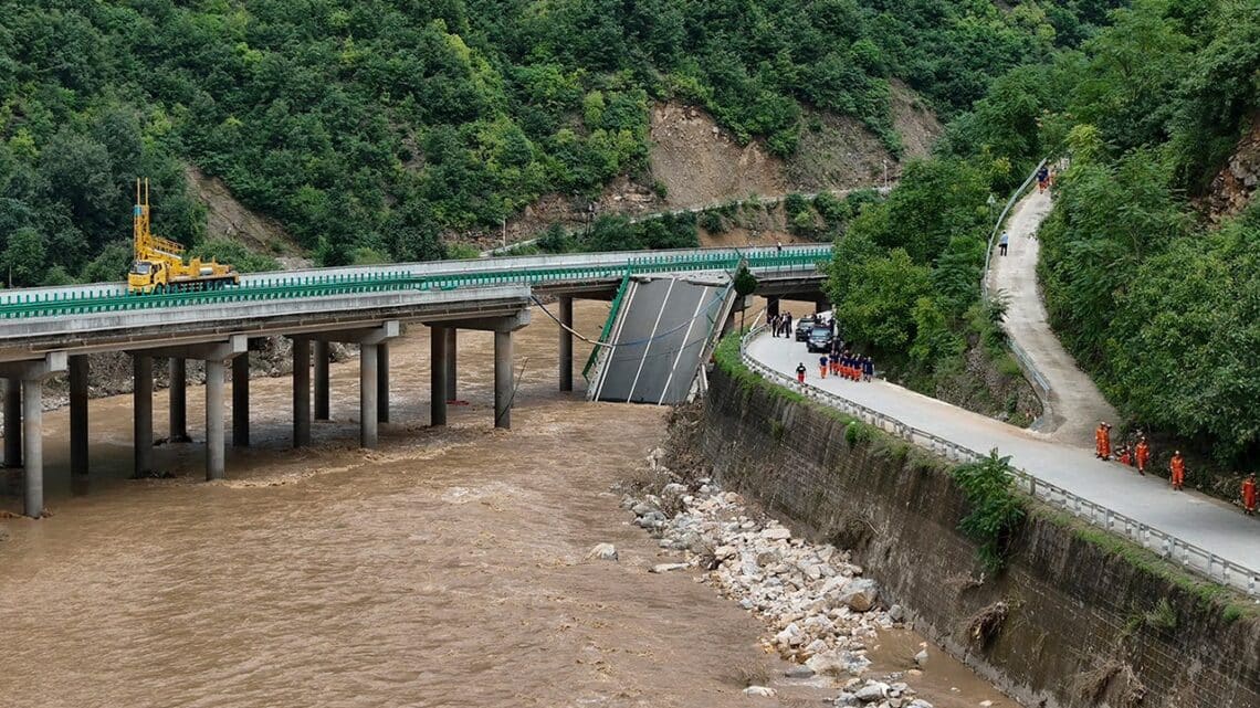 11 dead and dozens missing after a highway bridge in China crumbles in flooding