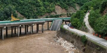 11 dead and dozens missing after a highway bridge in China crumbles in flooding
