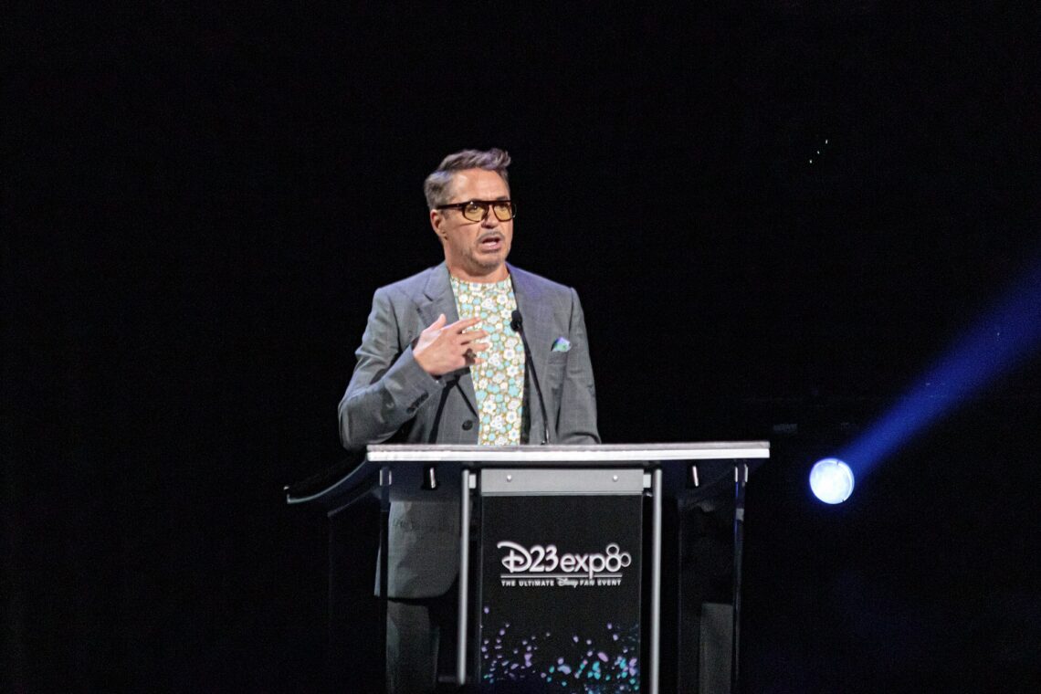 Avengers: Endgame Cast Net Worth 2026: Richest Avengers Ranked Robert Downey Jr. speaking on stage at D23 Expo 2019