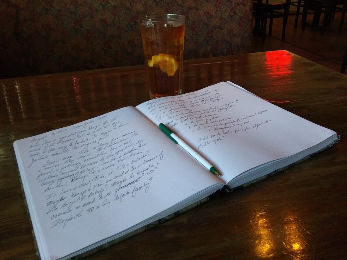 How to Take Better Notes: 5 Proven Methods for Students An open notebook with handwritten notes and a pen