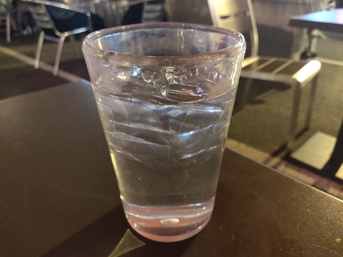 How Much Water Should You Drink a Day? What the Evidence Says A glass of drinking water on a table