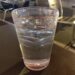 A glass of drinking water on a table