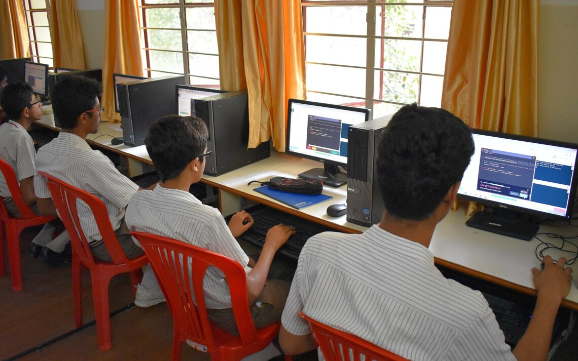 What Is NEP 2020? Key Changes Explained for Students and Parents Students learning on computers at a school in Bengaluru