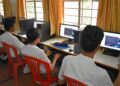 Students learning on computers at a school in Bengaluru