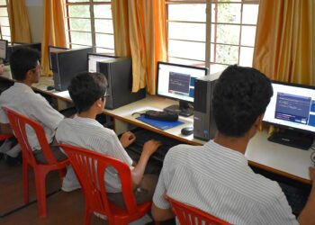 Students learning on computers at a school in Bengaluru