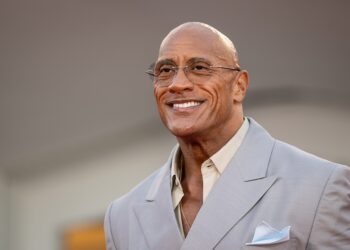 Dwayne "The Rock" Johnson smiling at a film premiere