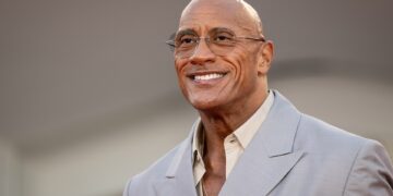 Dwayne "The Rock" Johnson smiling at a film premiere