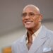 Dwayne "The Rock" Johnson smiling at a film premiere