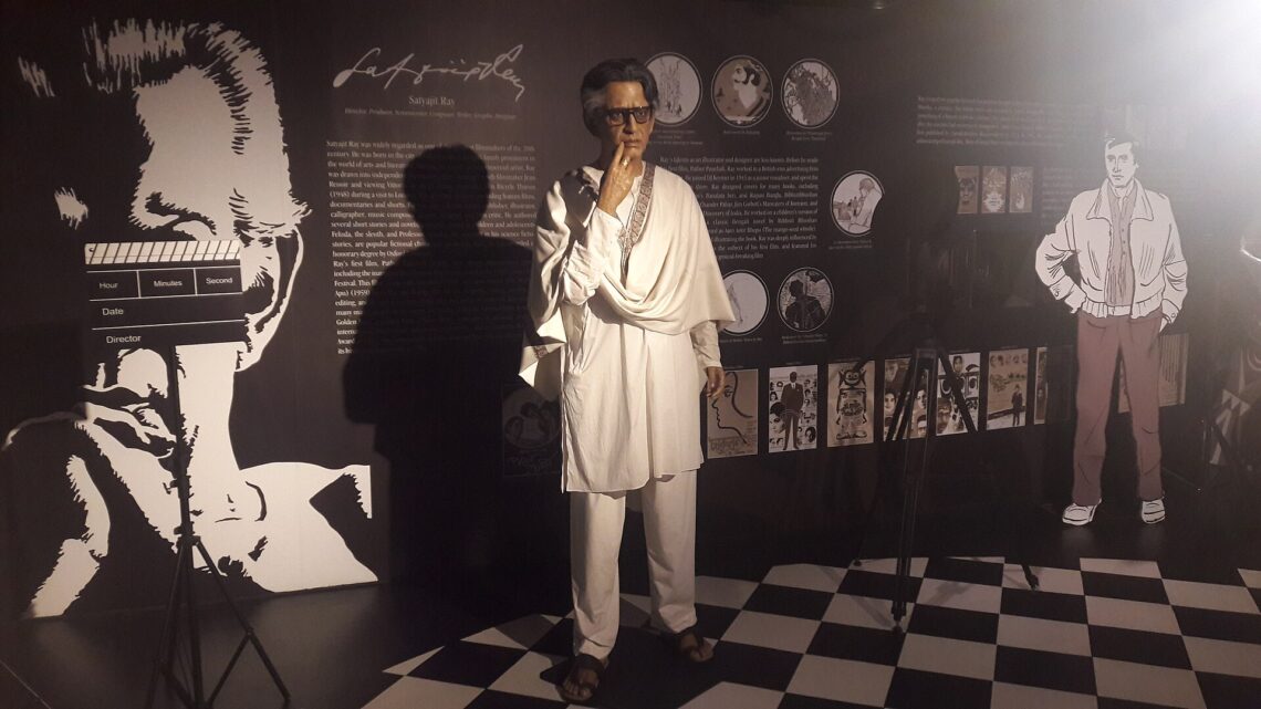 Satyajit Ray’s Apu Trilogy: A Beginner’s Guide to the Films and Why They Matter Wax figure of filmmaker Satyajit Ray at Mother’s Wax Museum, Kolkata