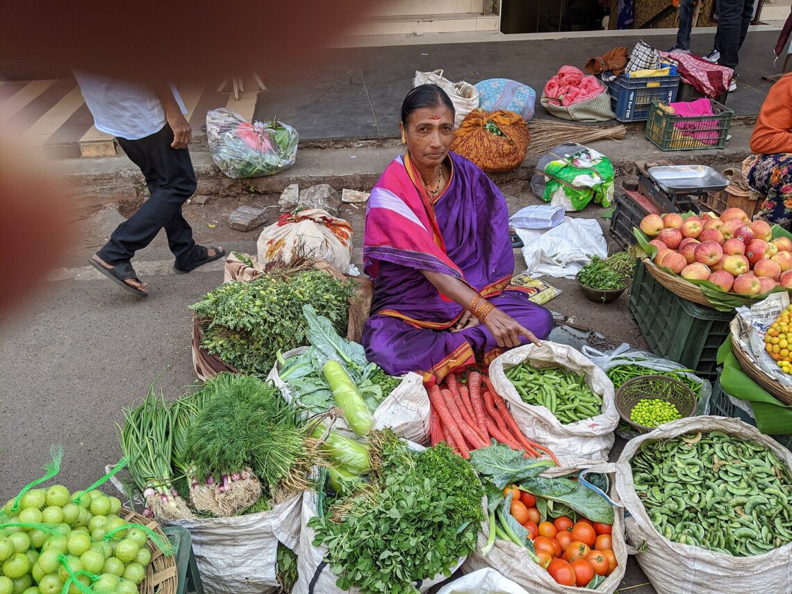 What Is UPI and How Does It Work? A Simple Explanation A vegetable vendor at a market in Pune, India