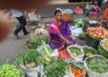 What Is UPI and How Does It Work? A Simple Explanation A vegetable vendor at a market in Pune, India