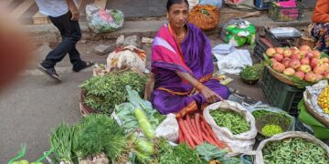 A vegetable vendor at a market in Pune, India