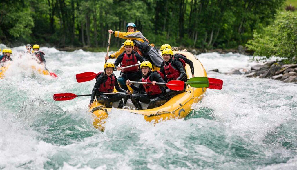 8 Best Places for River Rafting in India: Rivers, Grades, Season A raft crossing rapids on the Ganga near Rishikesh, Uttarakhand