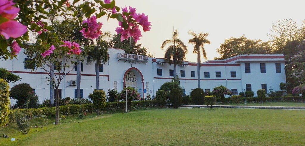 AMU Entrance Question Papers PDF: Class 6 to MBA (2026) Aligarh Muslim University campus building, which conducts AMU entrance tests