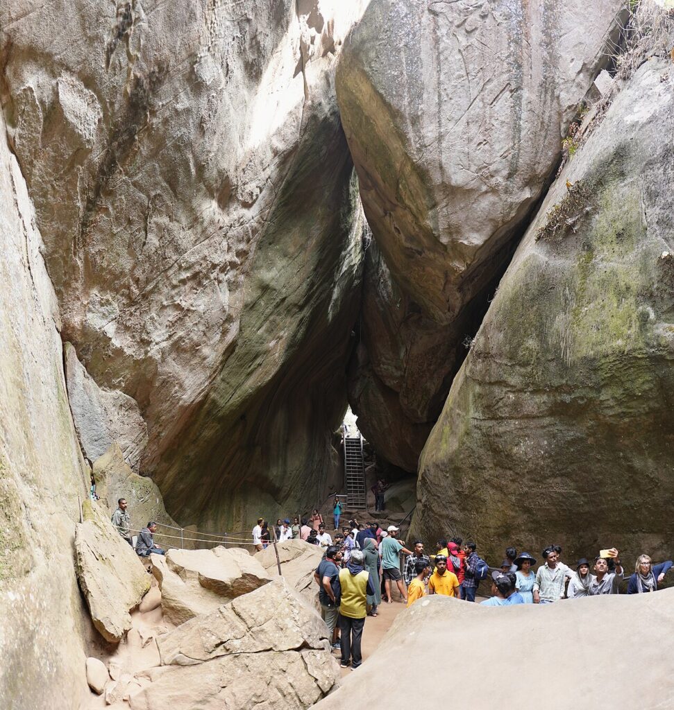 8 Best Places to Visit in Wayanad: Caves, Peaks, Lakes and More Ancient rock engravings inside the Edakkal Caves on Ambukuthi Mala in Wayanad, Kerala