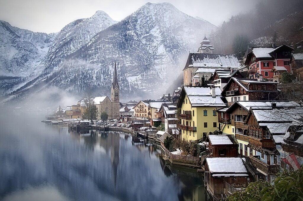 9 Breathtaking Winter Destinations Around the World to Visit Snow-covered Hallstatt village on the lake in Austria, one of the world's best winter destinations
