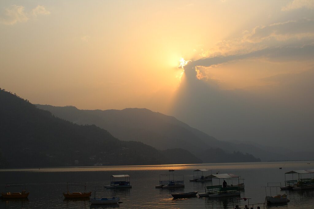 Boats on Phewa Lake in Pokhara, Nepal, one of the cheapest foreign trips from India