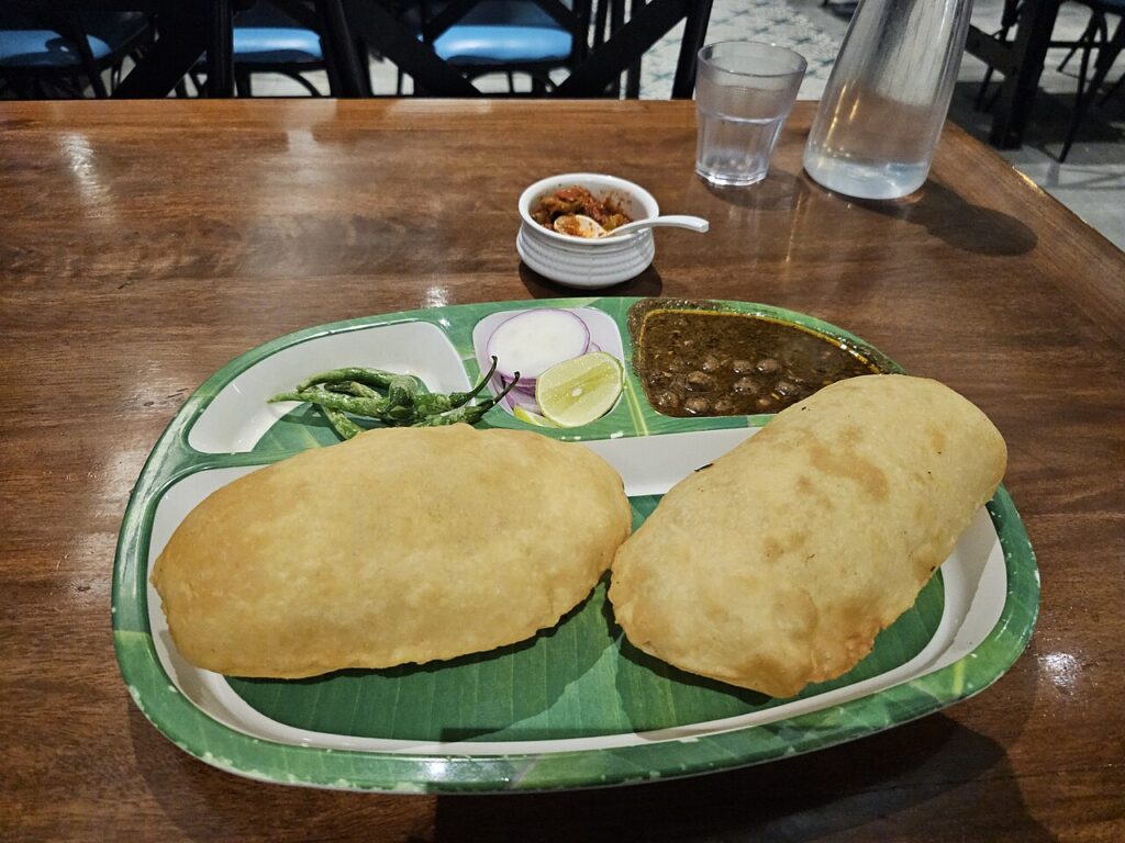 Delhi Food Guide: 8 Delectable Dishes You Must Try in Delhi A plate of chole bhature, one of the most popular dishes to try in Delhi