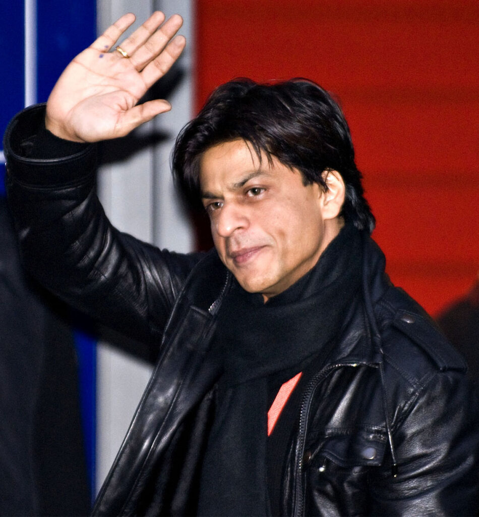 Shah Rukh Khan at a public event, the actor behind many of Bollywood's most quoted dialogues