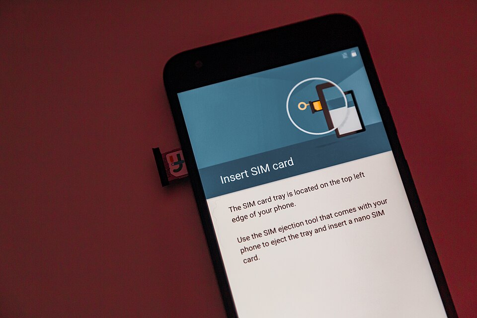 How to Activate eSIM in Jio, Airtel and Vi: Step-by-Step Guide Person entering eSIM details on a phone to switch from a physical SIM
