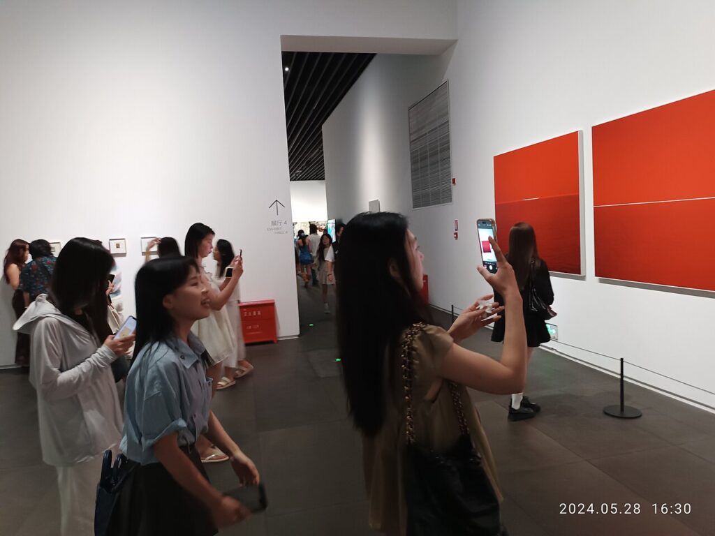 A person taking a photo on a smartphone for an Instagram post