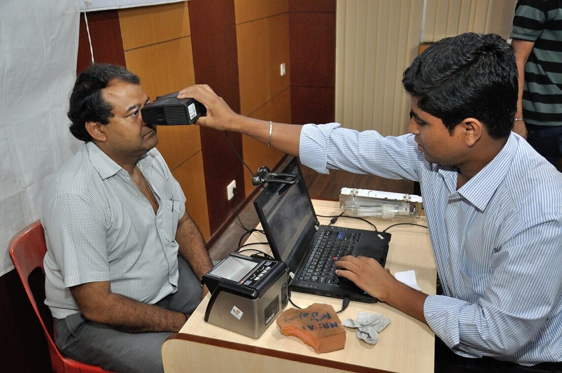 How to Lock Aadhaar Biometrics Online: Step-by-Step Guide Iris scan being taken during Aadhaar biometric data collection in Kolkata