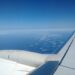 Ryanair Cabin Bag Size 2026: Free Bag, Priority and Gate Fees Small backpack and wheeled cabin bag at an airport gate before a budget airline flight in Europe