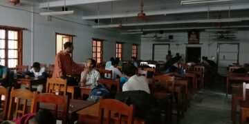 College student creating an Academic Bank of Credits ID on a laptop