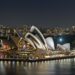 Clock face with the Sydney skyline in the background marking daylight saving in Australia