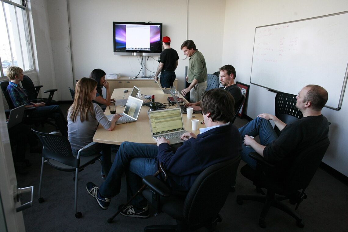 Critical Success Factors (CSFs): Meaning, Examples and How They Differ From KPIs A team meeting in an office
