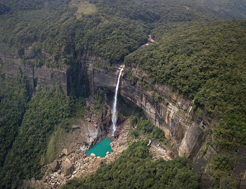 Nohkalikai Falls plunging from the Sohra plateau into a green pool in Meghalaya